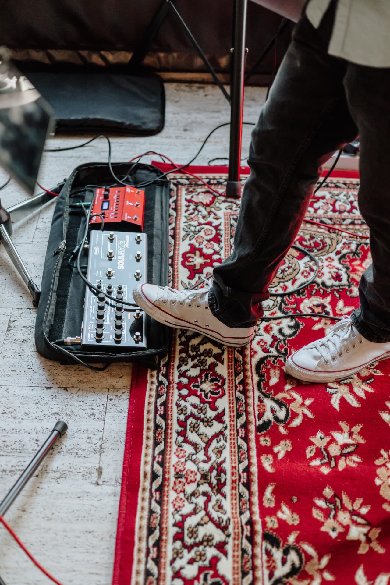 Guitar pedalboard and effects units set up on stage